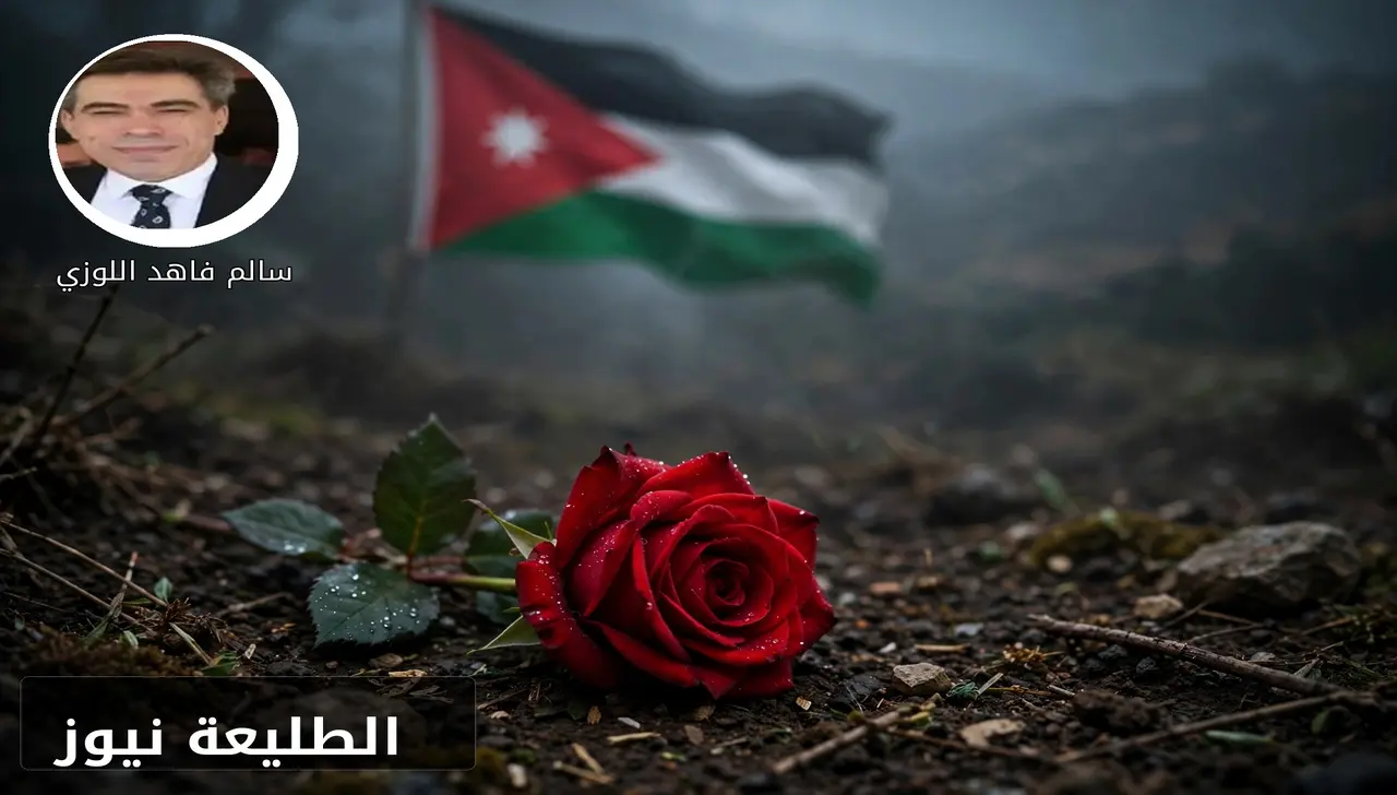 وردة حمراء على تراب مبلل ترمز للدماء الزكية وشهداء الوطن وعلم الأردن يرفرف خلفها بحزن وشموخ كبير